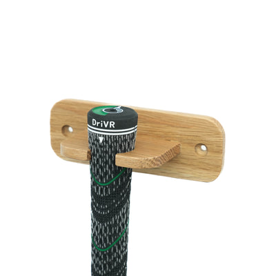 Wooden hook with a black and green strap labeled 'DrivR' on a white background